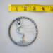 Wire art showing a silver tree with twisted roots and branches against a tape measure to show 3inch size
